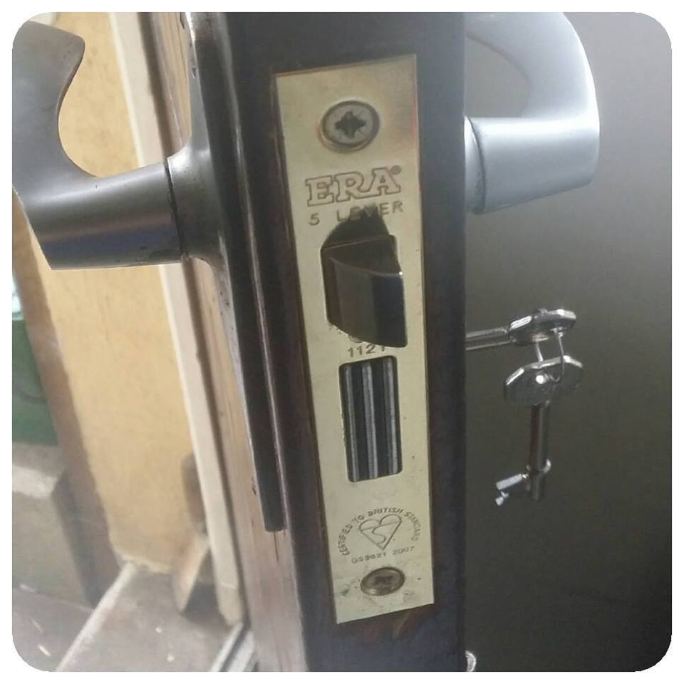brass five lever sashlock in a wooden door